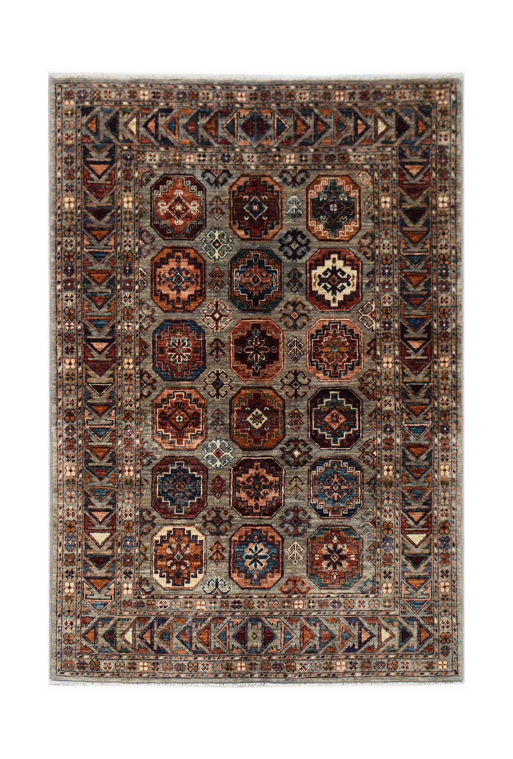Handmade Afghan Chobi rug featuring a grey field with repeating geometric octagonal medallions.