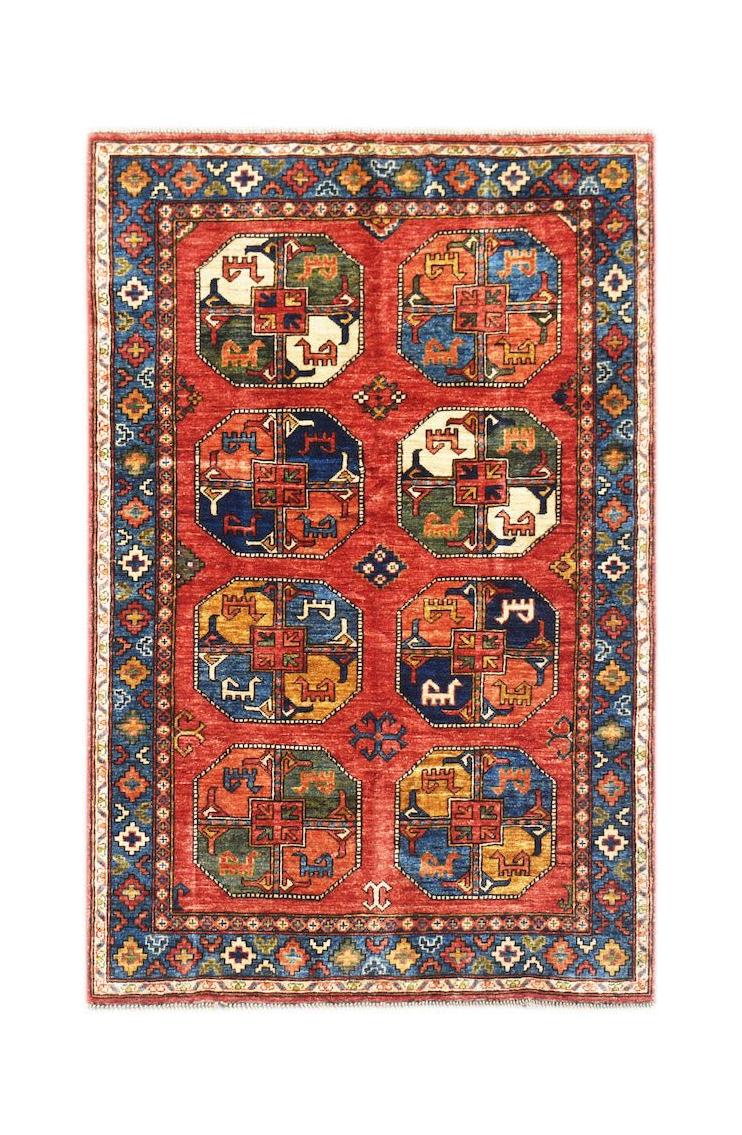 Handwoven Afghan Chobi rug featuring eight geometric medallions on a red field with a blue border.