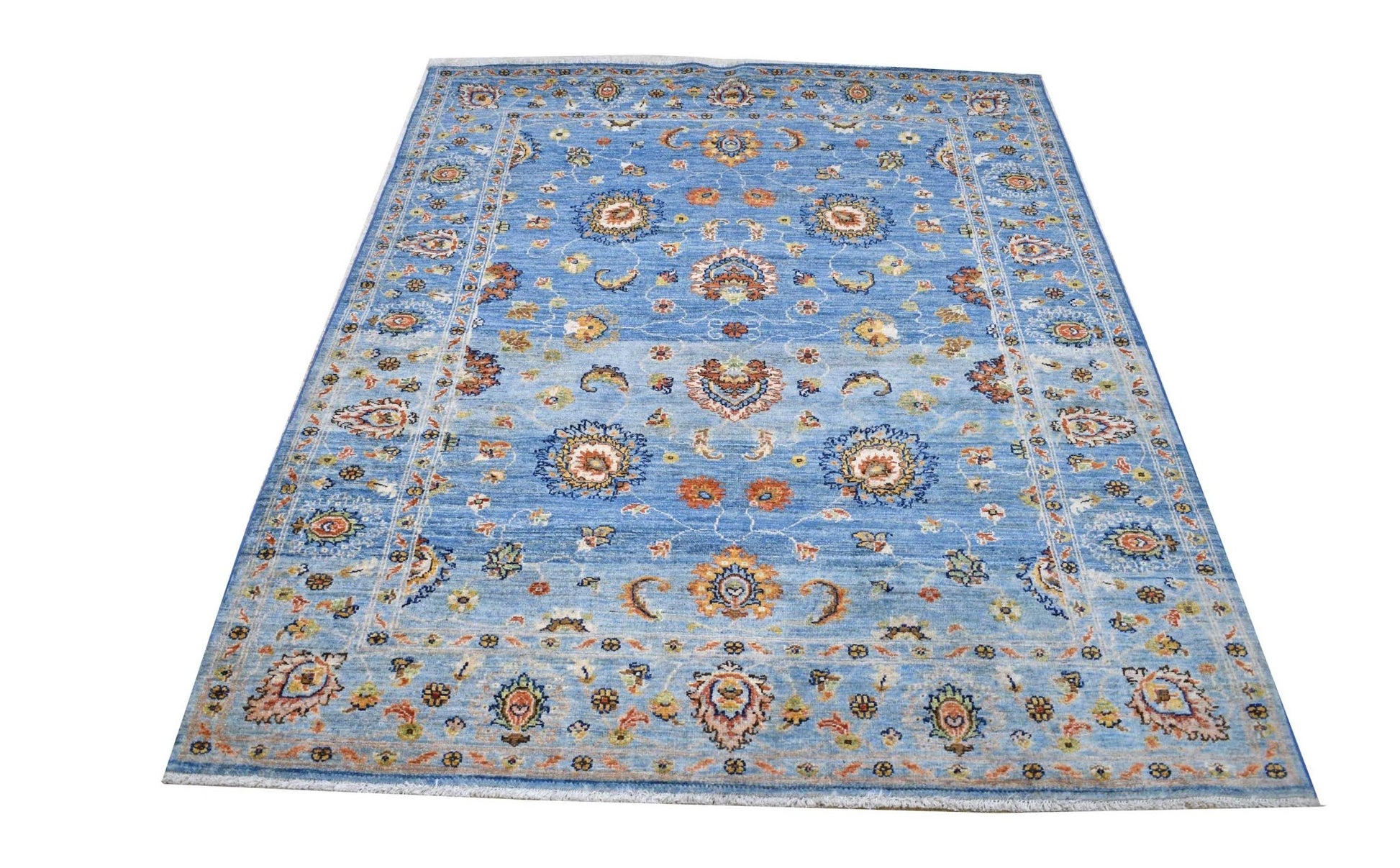 A rectangular Afghan Chobi rug featuring intricate floral patterns in earthy tones on a blue field.