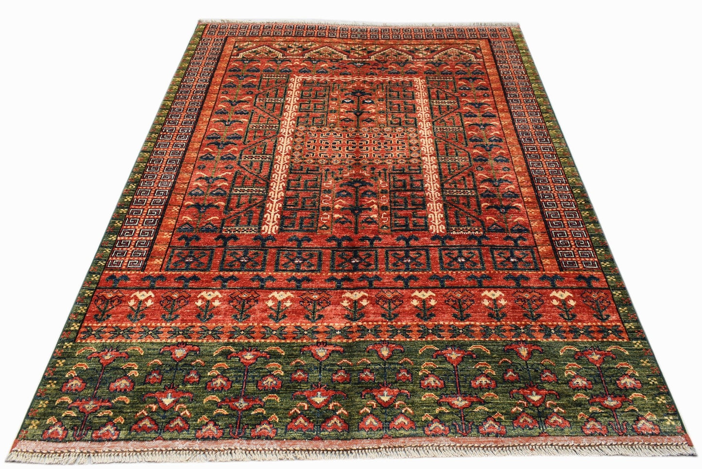 A rectangular Afghan Chobi rug featuring a geometric red field with a dark green floral border.