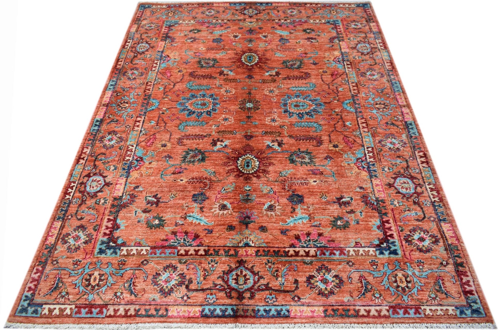 A rectangular Afghan Chobi rug featuring a traditional floral pattern in shades of orange and blue.