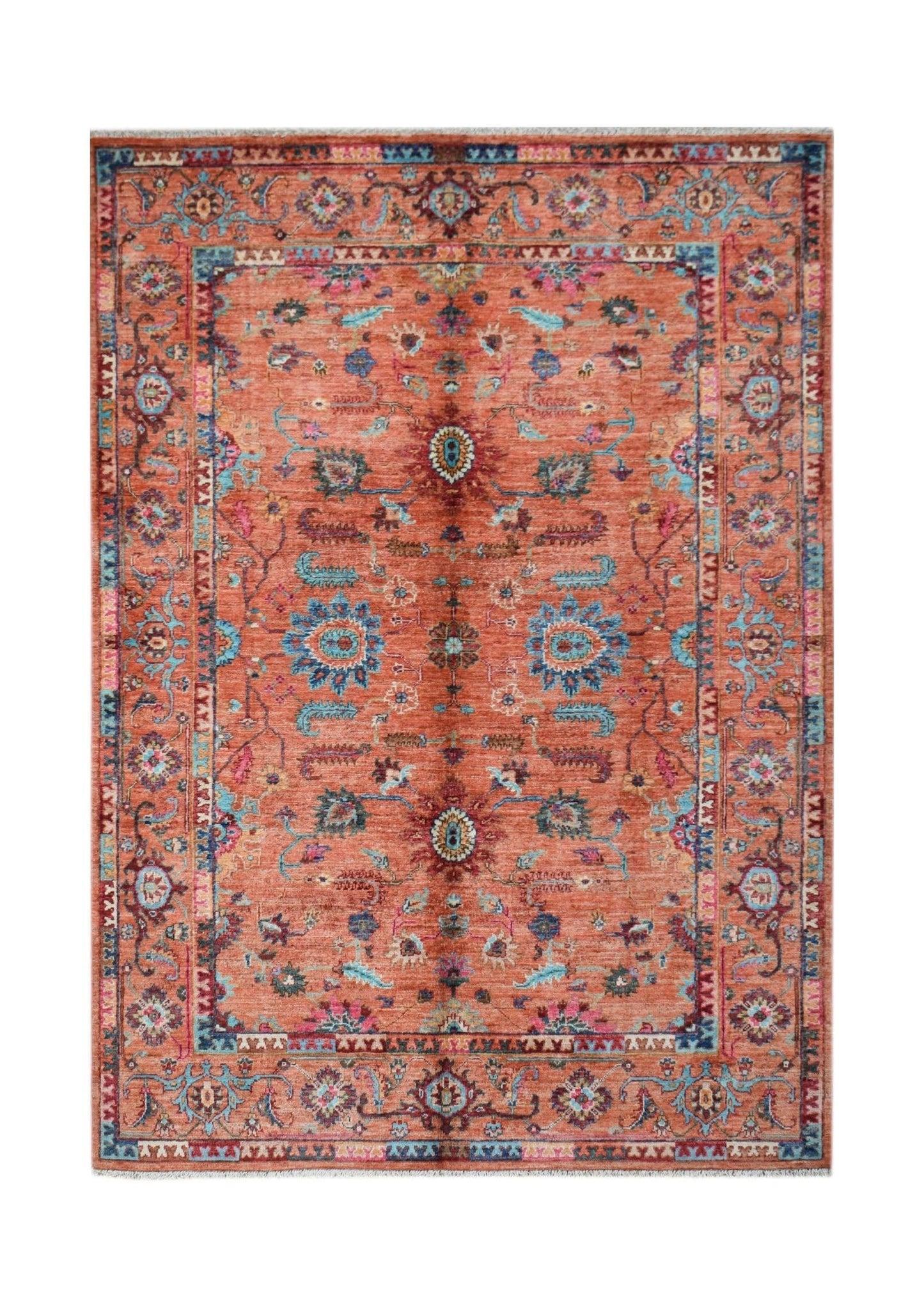 Handwoven Afghan Chobi rug featuring a traditional floral pattern in terracotta and blue tones.