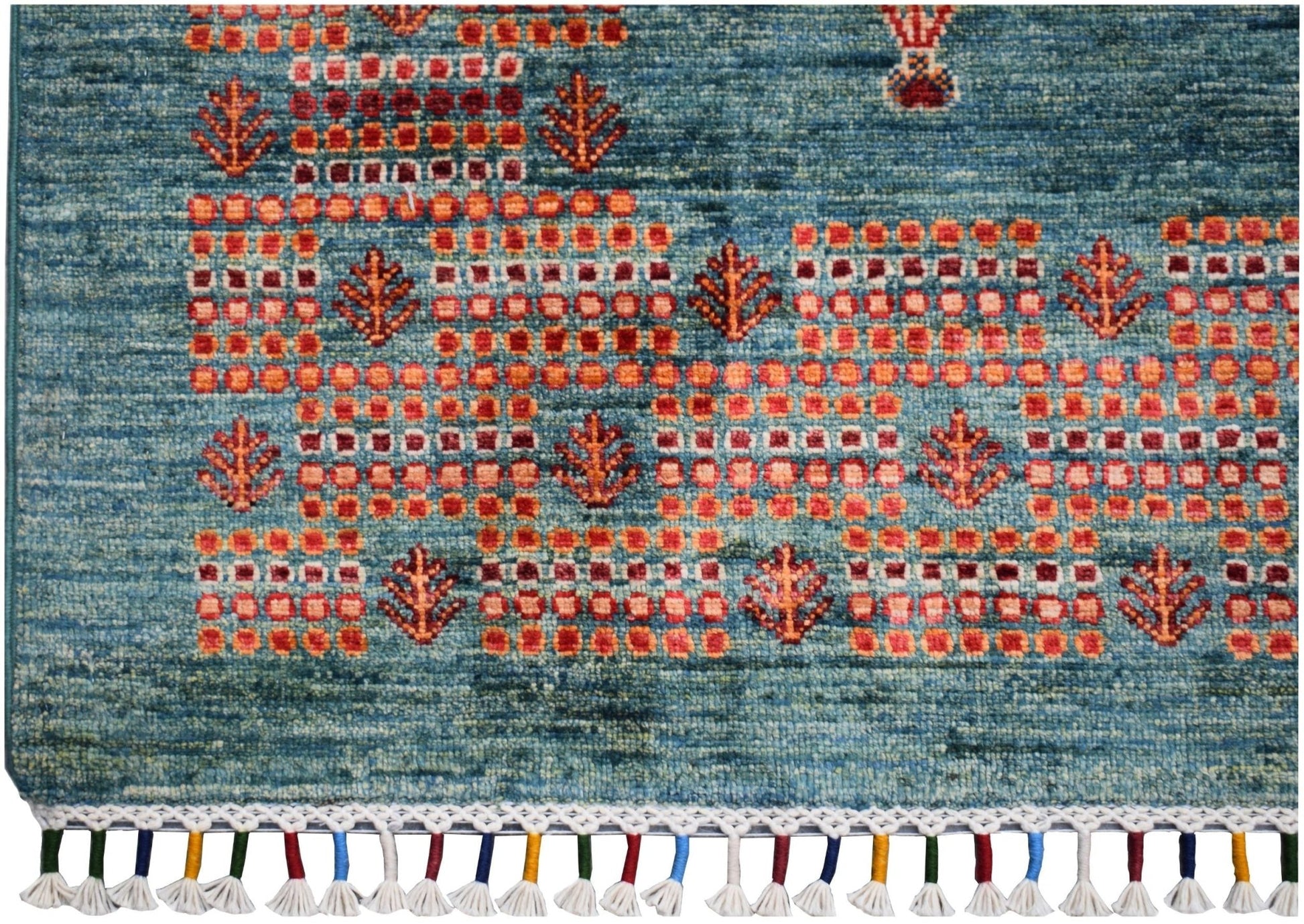 Handmade Afghan Chobi rug featuring a blue field with geometric orange patterns and tasseled edges.