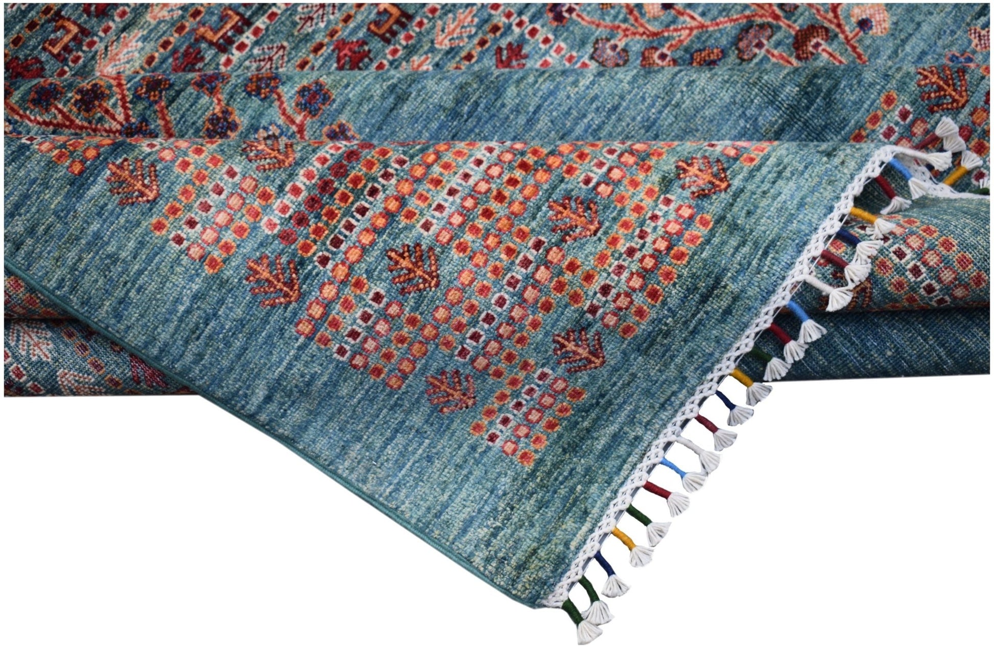 A handmade Afghan Chobi rug featuring a blue field with geometric patterns and tasseled edges.