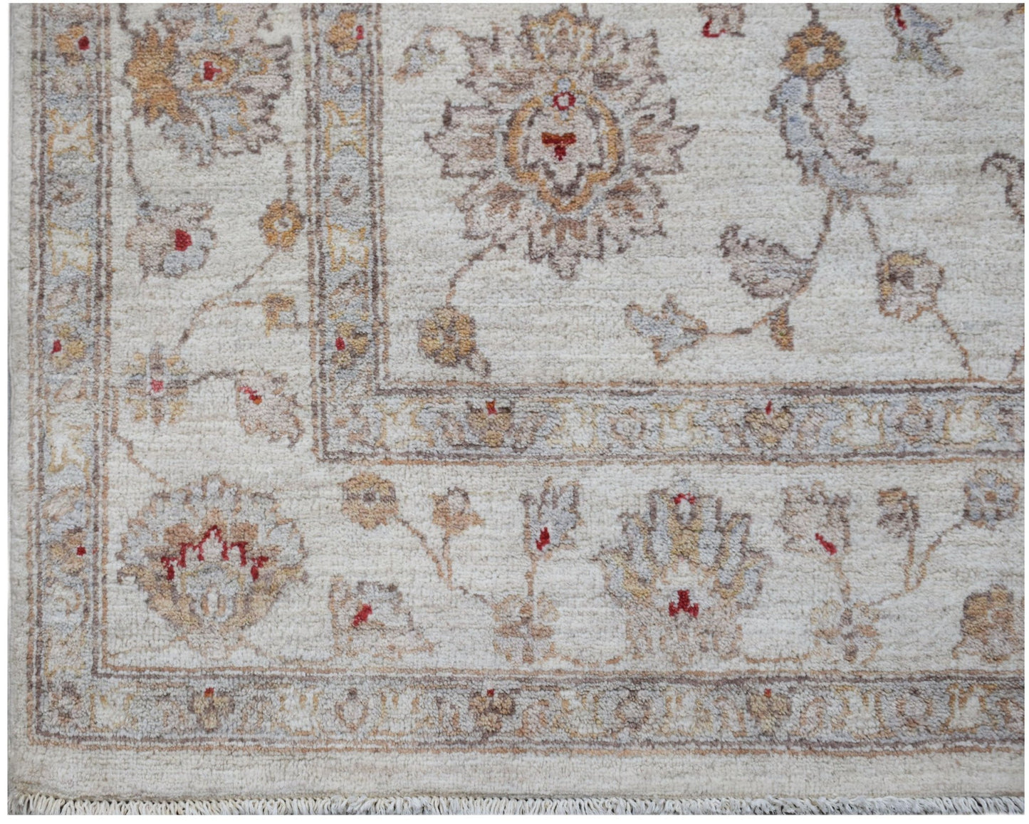 A handmade Afghan Chobi rug featuring a traditional floral pattern in soft, earthy wood tones.