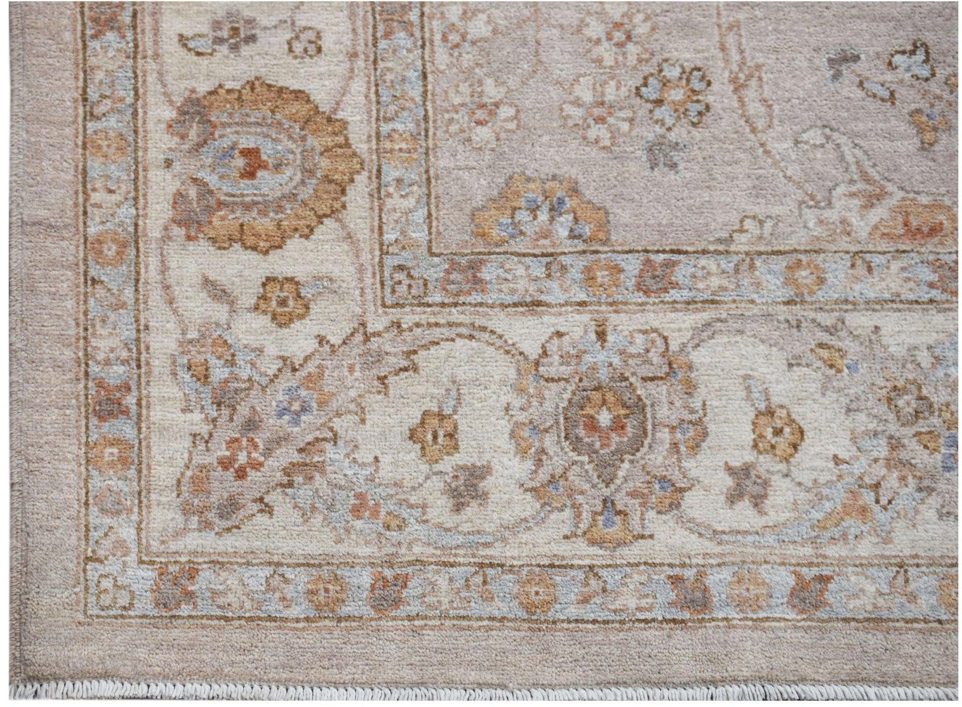 A handmade Afghan Chobi rug featuring a traditional floral pattern in soft, earthy wood tones.