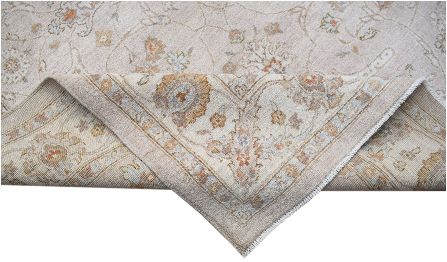 A handwoven Afghan Chobi rug featuring a traditional floral pattern in soft, earthy wood tones.