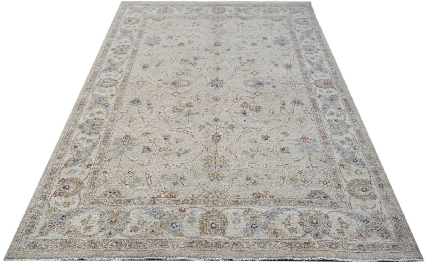A rectangular Afghan Chobi rug featuring a traditional floral pattern in soft, earthy tones.
