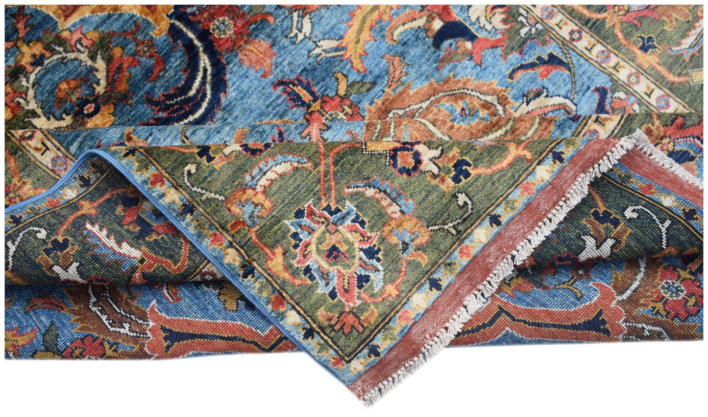 A handmade Afghan Chobi rug featuring a traditional floral pattern in blue, green, and rust tones.
