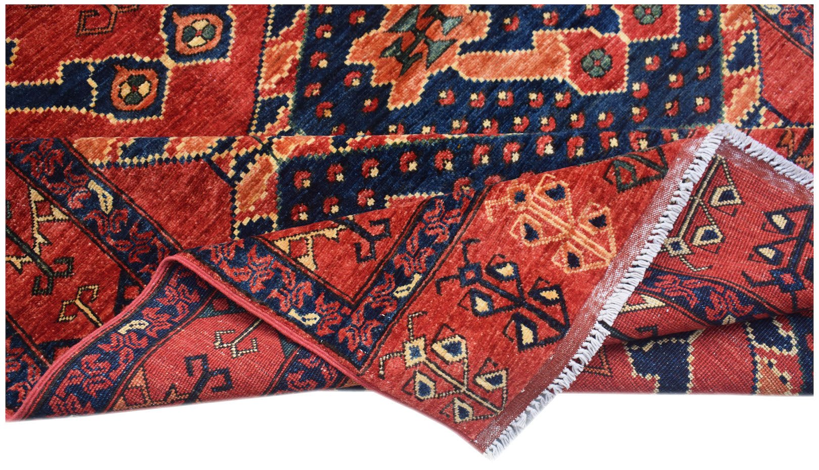 A handwoven Afghan Chobi rug featuring traditional geometric patterns in red and blue wool.