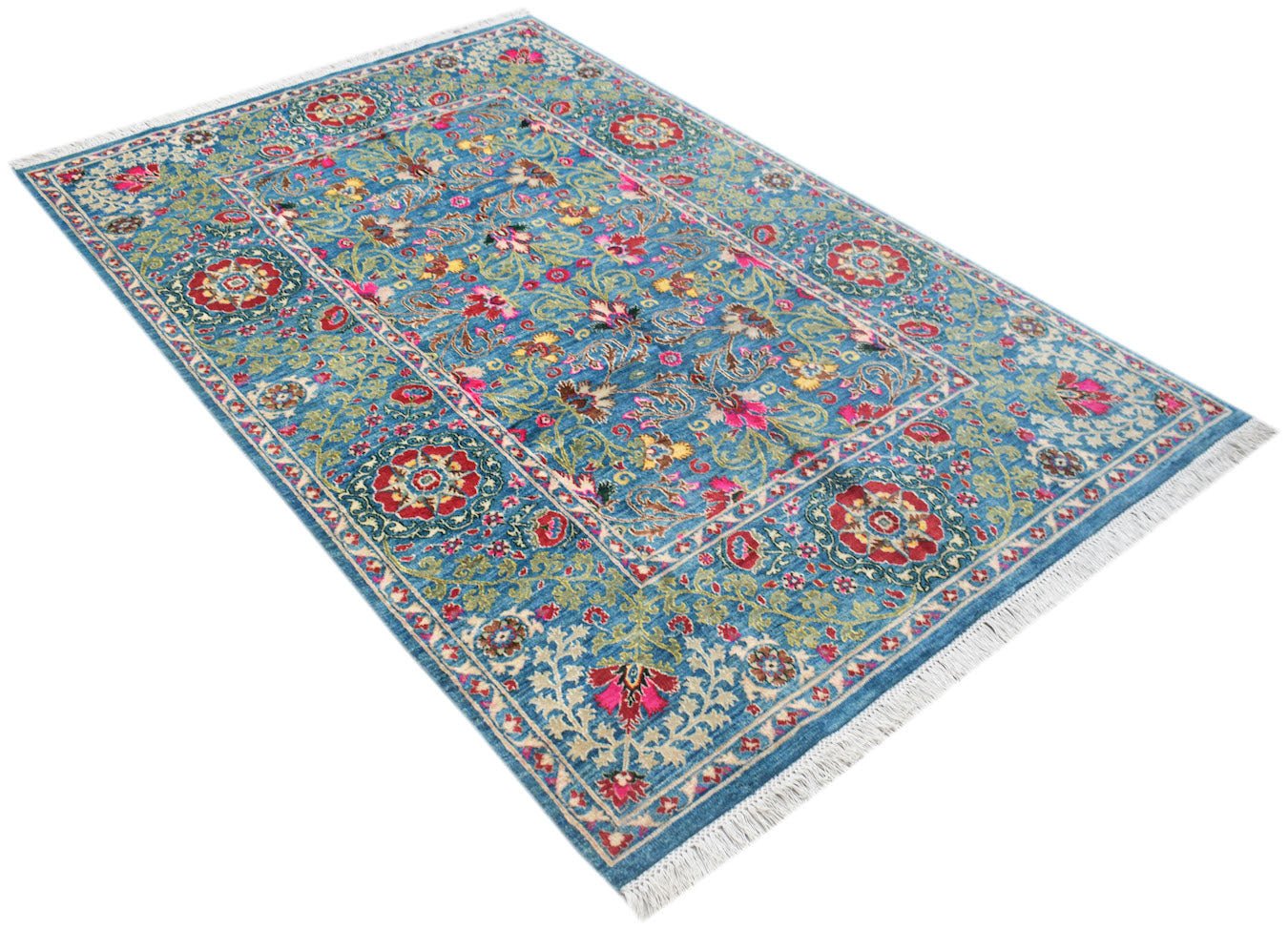 An Afghan Chobi rug featuring a blue field with intricate floral patterns and a fringed edge.
