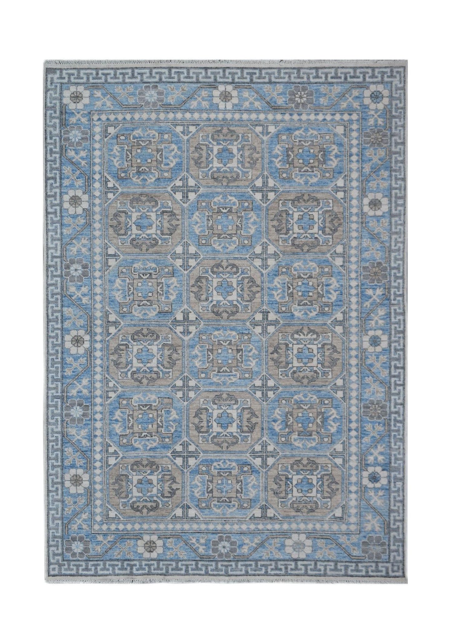 A rectangular Afghan Chobi rug featuring a geometric pattern in shades of blue, grey, and cream.