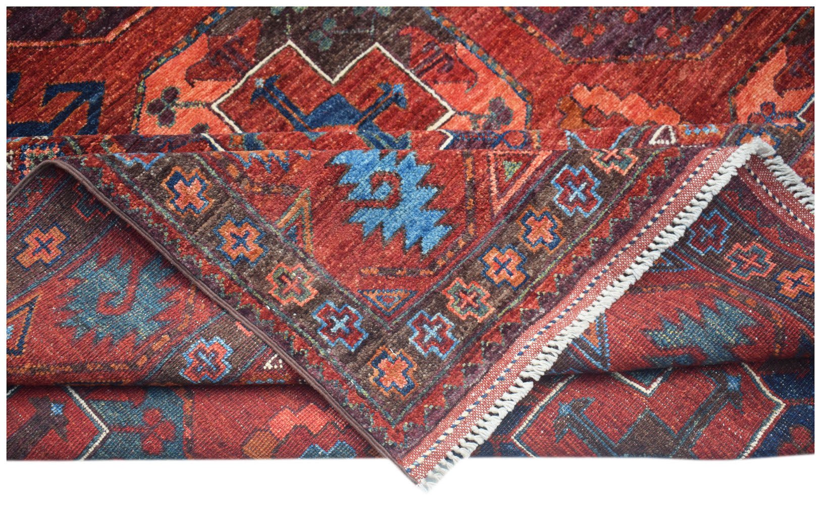 A handwoven Afghan Chobi rug featuring traditional geometric patterns in red, blue, and brown.