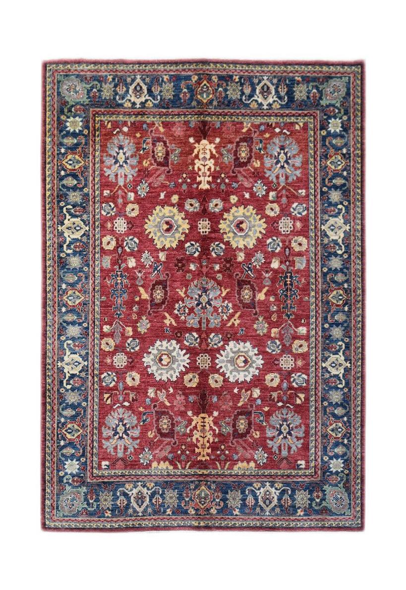 A rectangular Afghan Chobi rug featuring a traditional floral pattern in red, blue, and cream.