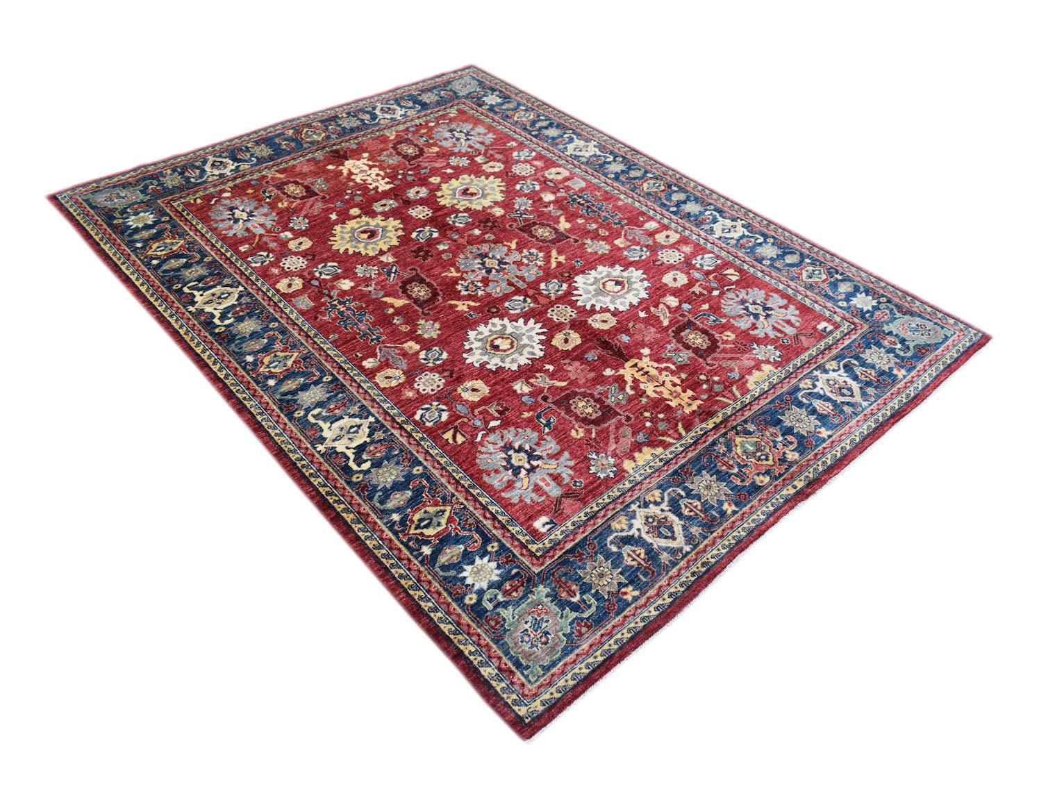 A rectangular Afghan Chobi rug featuring a traditional floral pattern in red and blue tones.