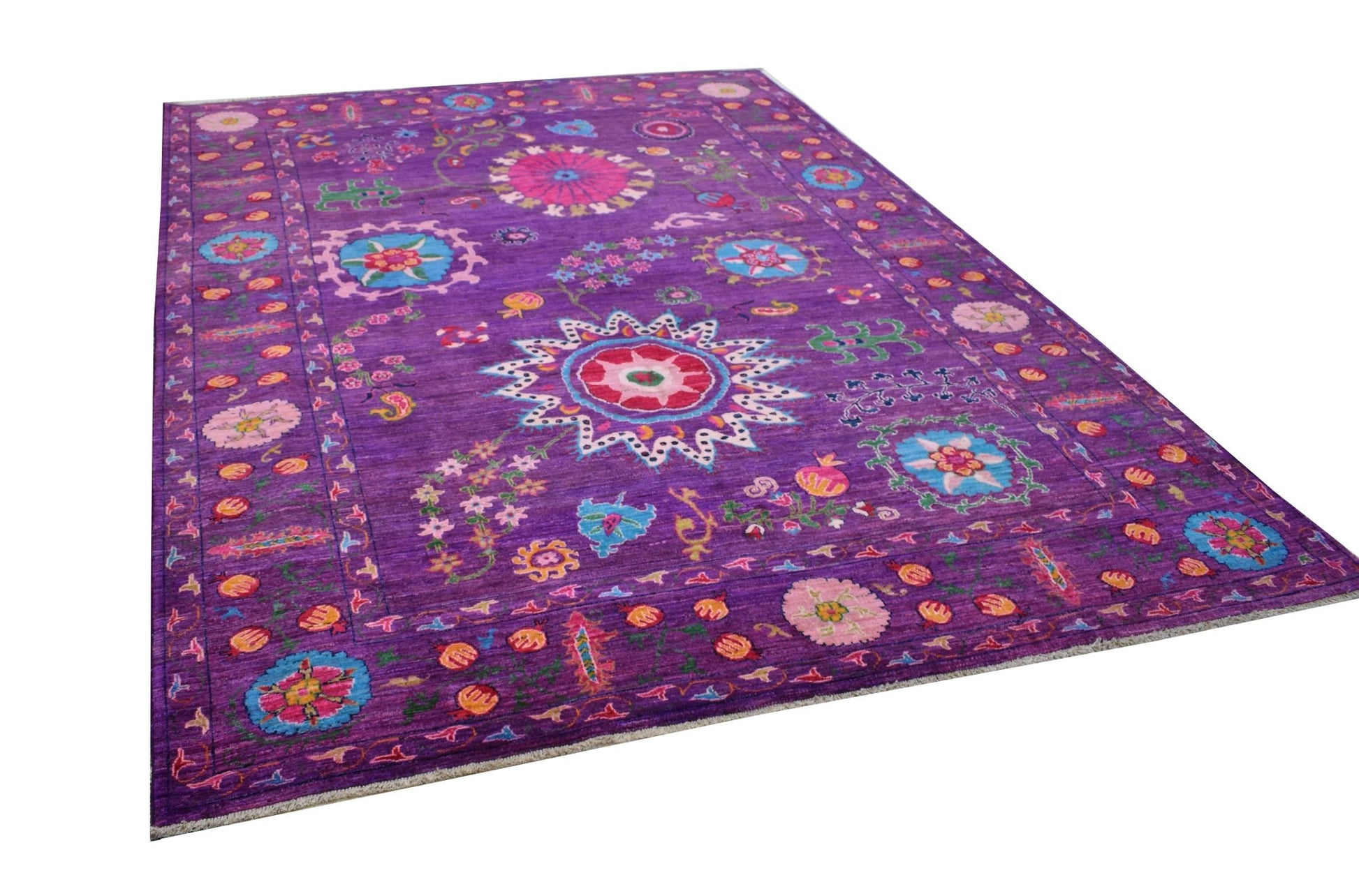 A rectangular Afghan Chobi rug featuring a vibrant purple field with colorful floral motifs.