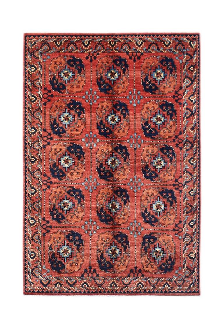 A rectangular Afghan Chobi rug featuring a repeating geometric pattern in red, blue, and cream.