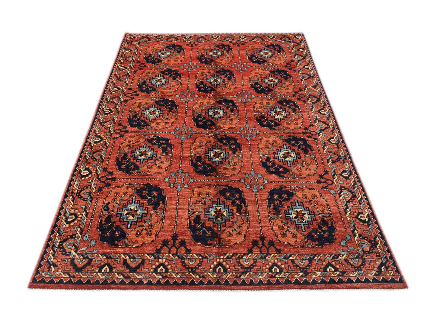 A rectangular Afghan Chobi rug featuring a repeating geometric medallion pattern in red and blue.
