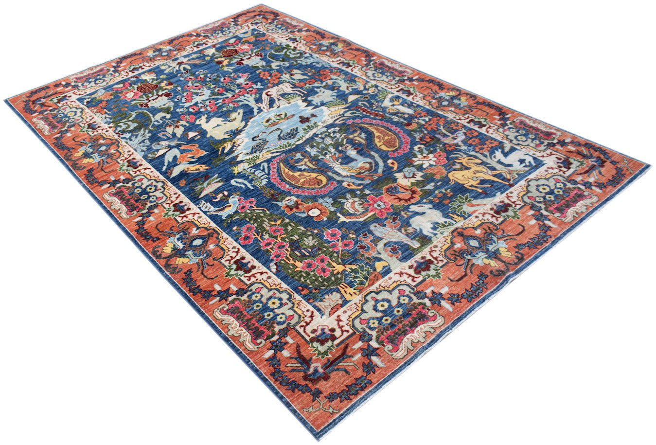 An Afghan Chobi rug featuring a blue field with intricate floral and animal motifs in a rust border.