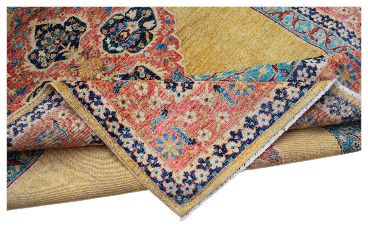 An Afghan Balkh rug with a yellow field and intricate floral patterns in red and blue.