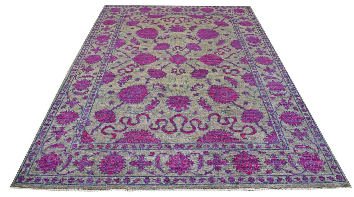 A rectangular Afghan Chobi rug featuring a floral pattern in vibrant magenta on a beige background.