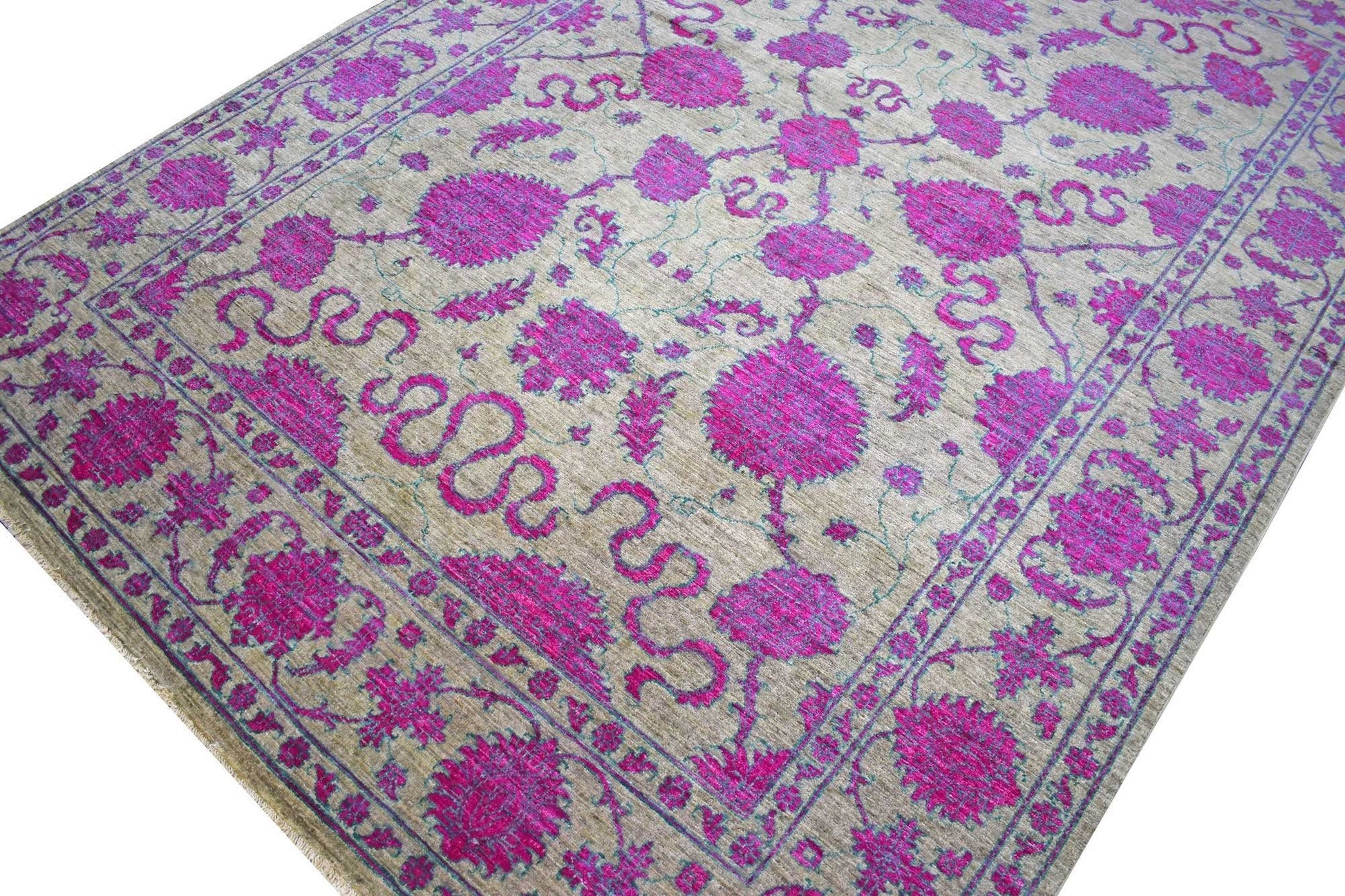 An Afghan Chobi rug featuring a vibrant magenta floral pattern on a neutral beige background.