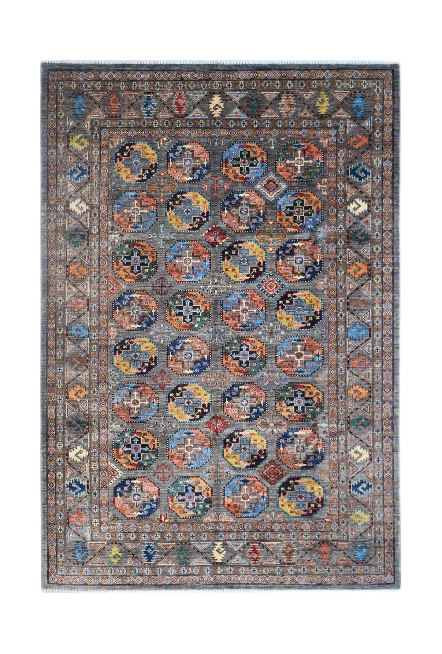 An Afghan Chobi rug featuring a grey field with repeating colorful geometric octagonal motifs.