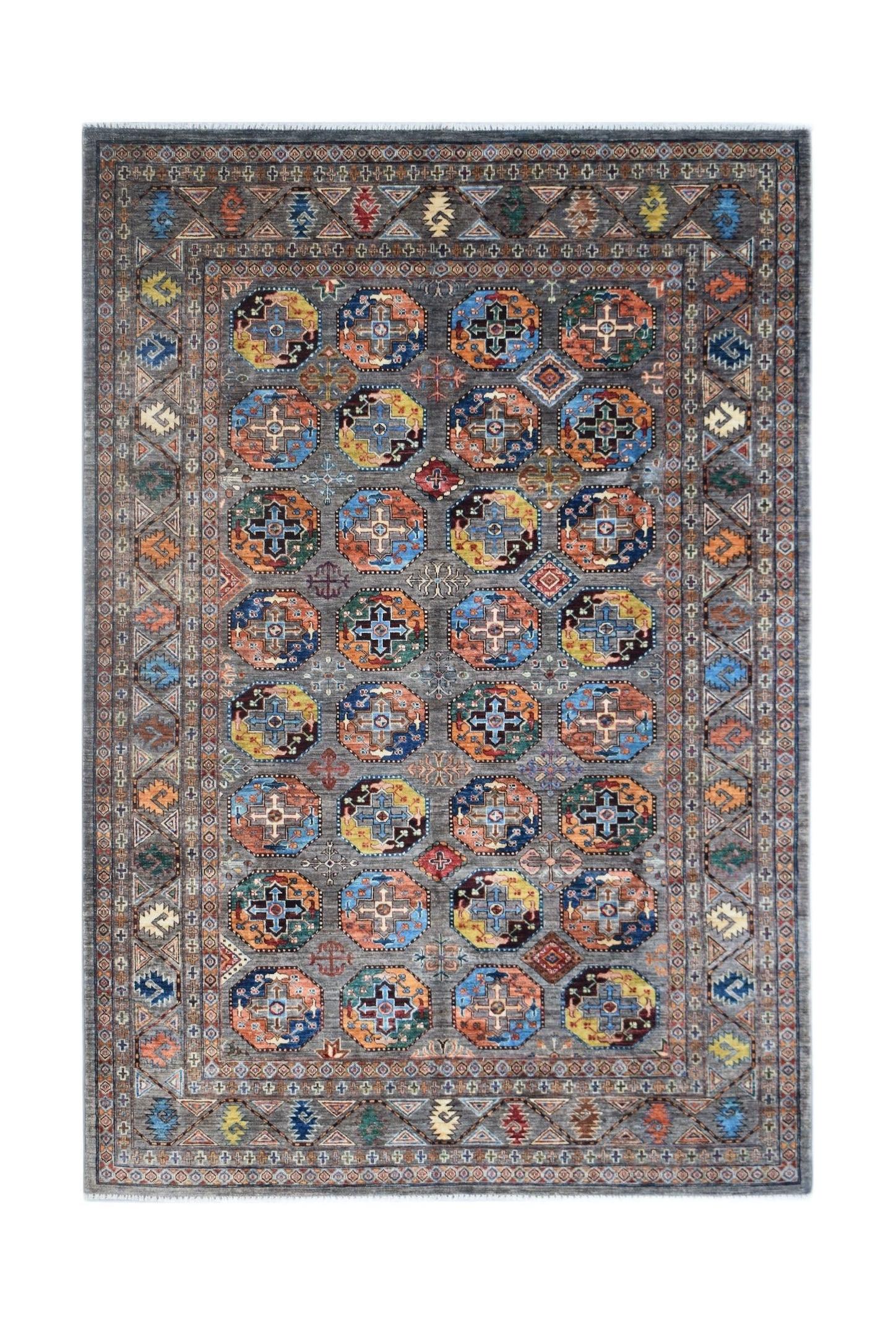 An Afghan Chobi rug featuring a grey field with repeating colorful geometric octagonal motifs.