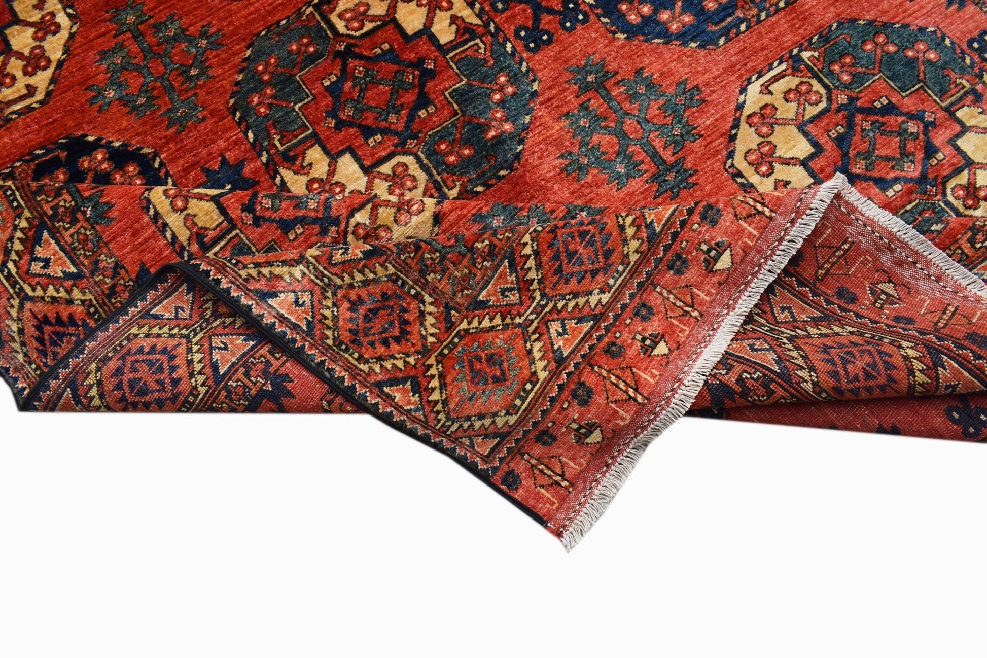 A handmade Afghan Chobi rug featuring traditional geometric patterns in red, blue, and beige.