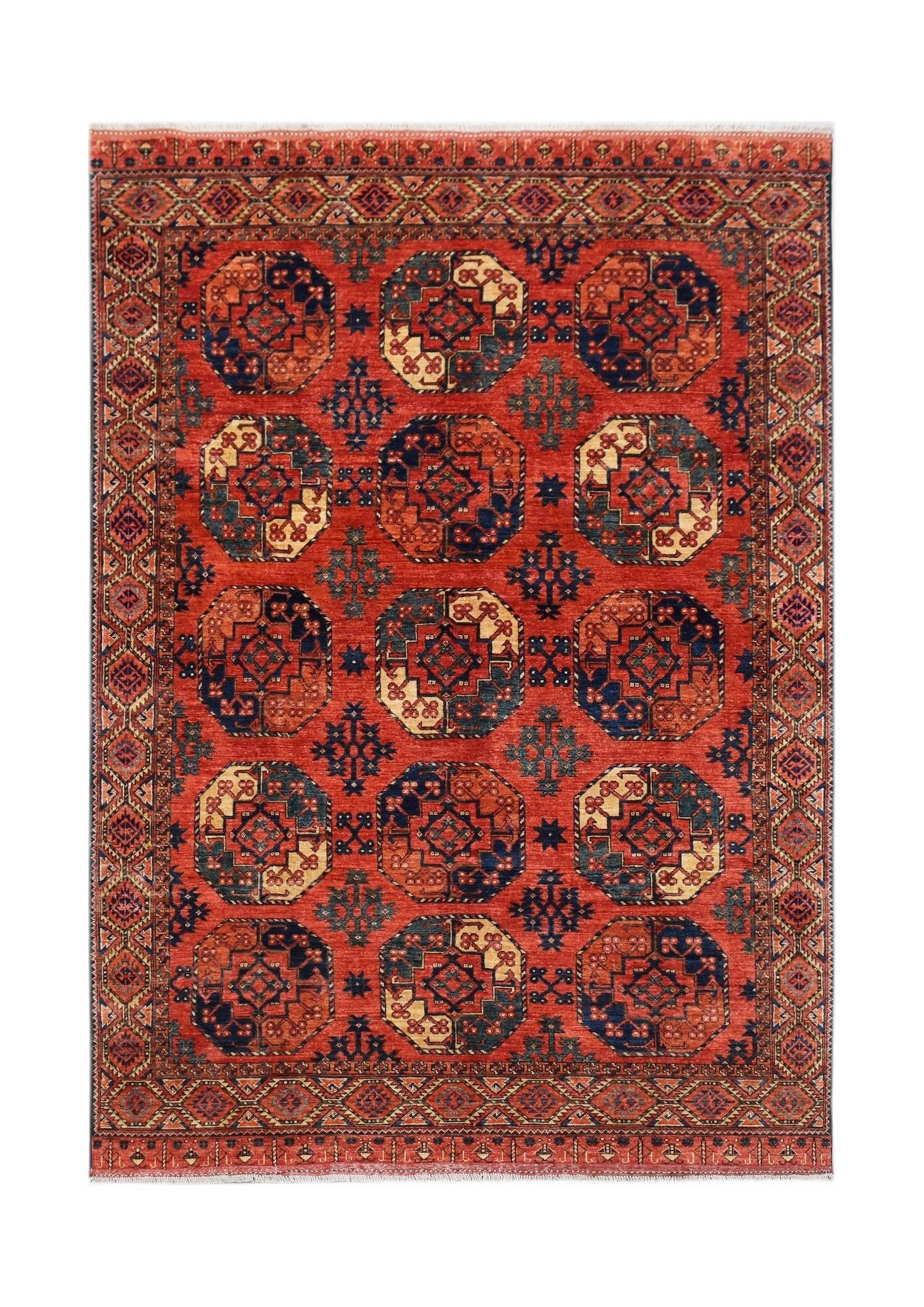 Handwoven Afghan Chobi rug featuring a repeating octagonal pattern in red, blue, and cream tones.
