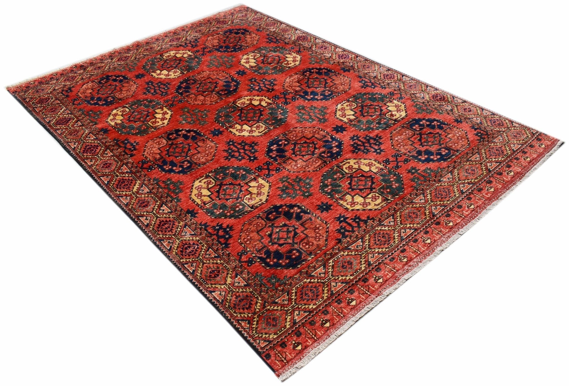 Handwoven Afghan Chobi rug featuring a traditional geometric pattern in shades of red and blue.