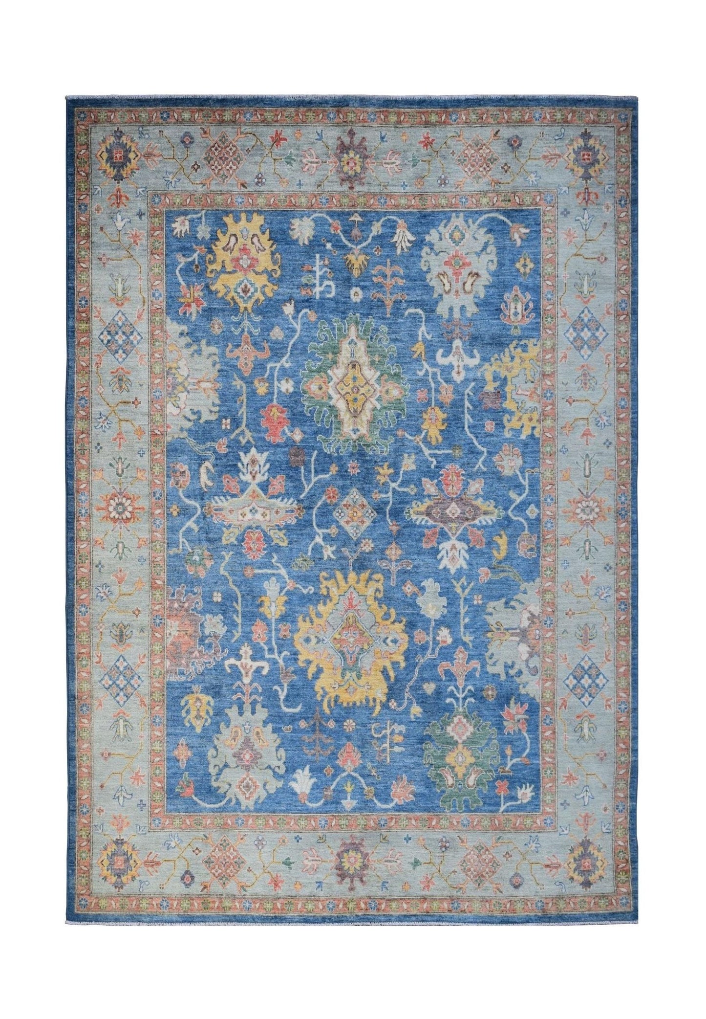 Handmade Afghan Chobi rug featuring a traditional floral pattern in blue, yellow, and soft tones.