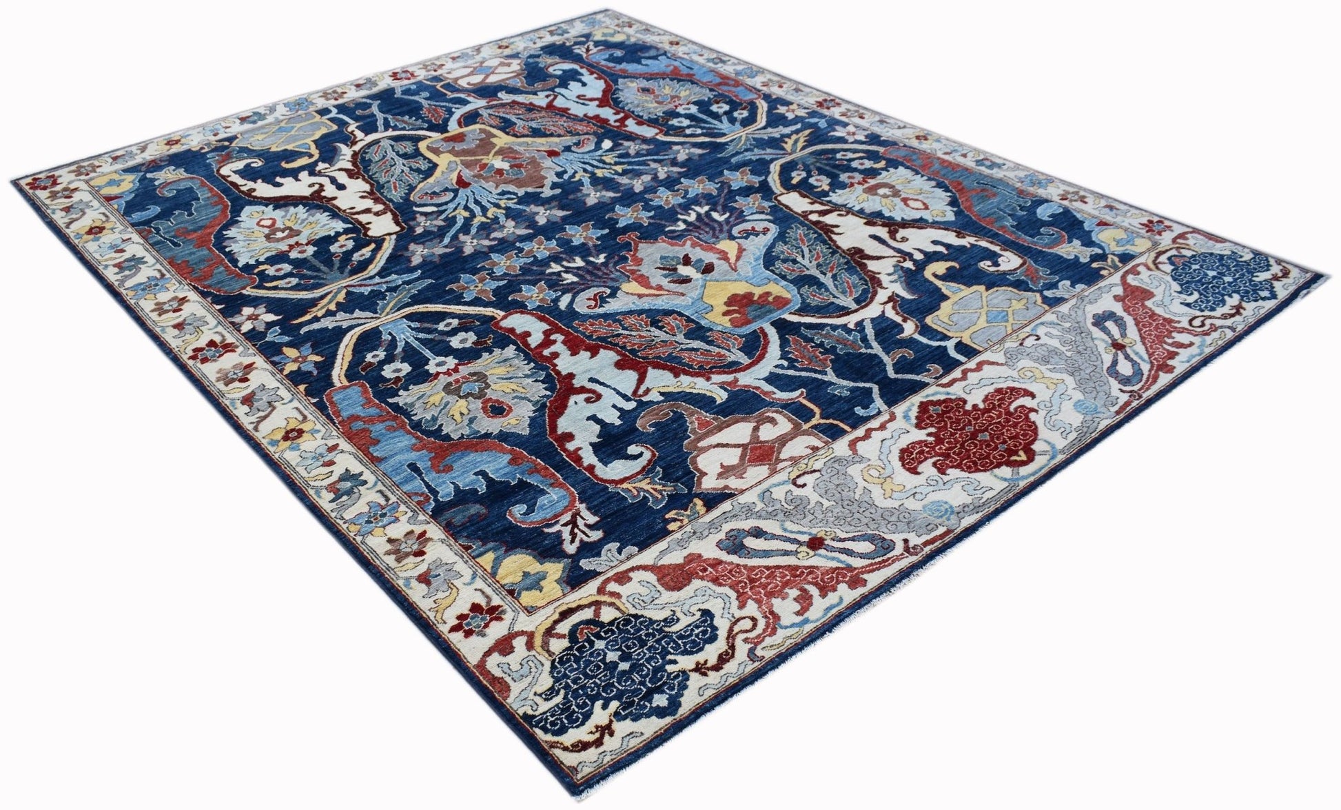 A rectangular Afghan Chobi rug featuring a traditional Bidjar floral pattern in blue and red tones.