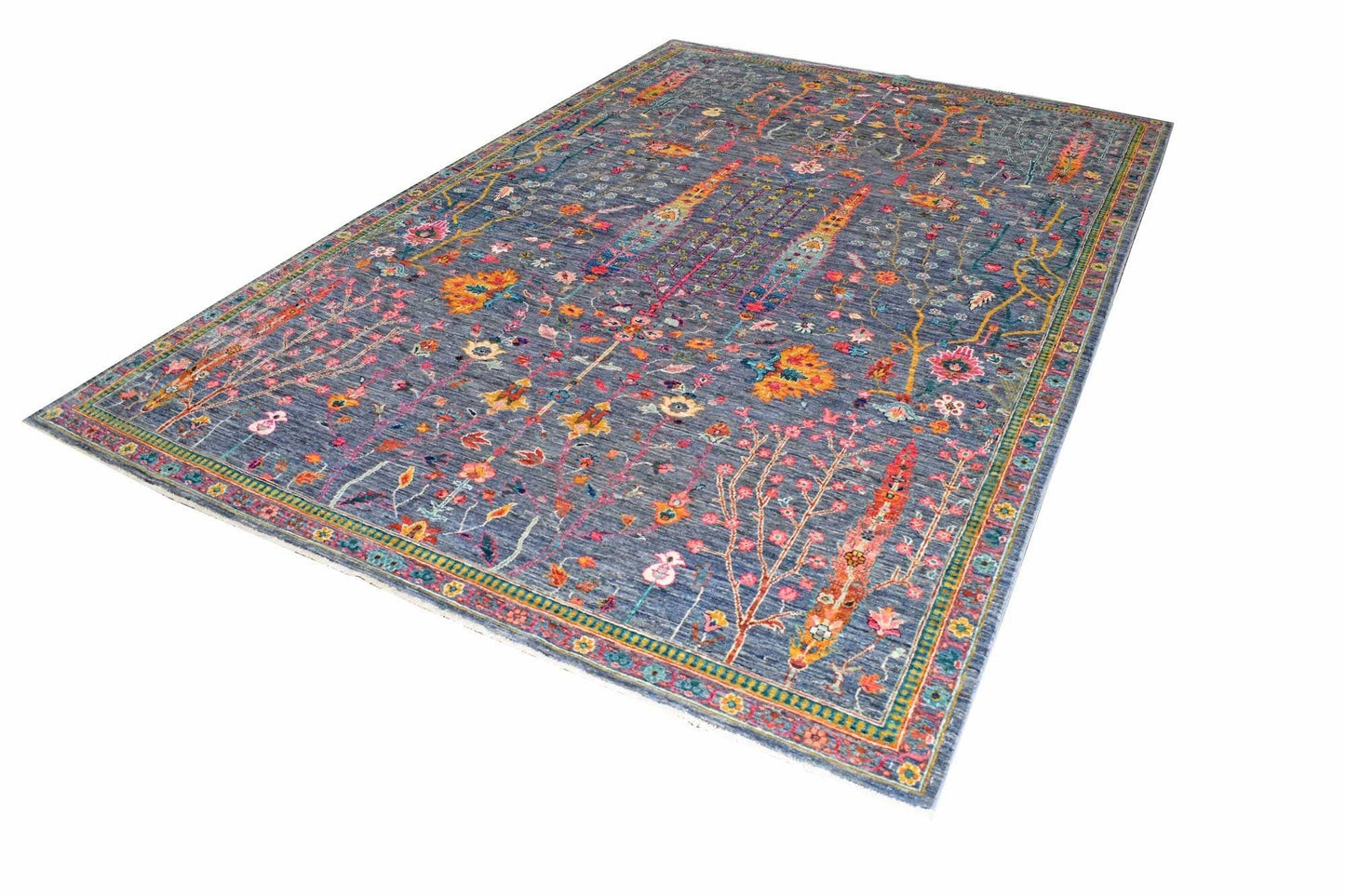A rectangular Afghan Chobi rug featuring a blue field with intricate floral and tree motifs.