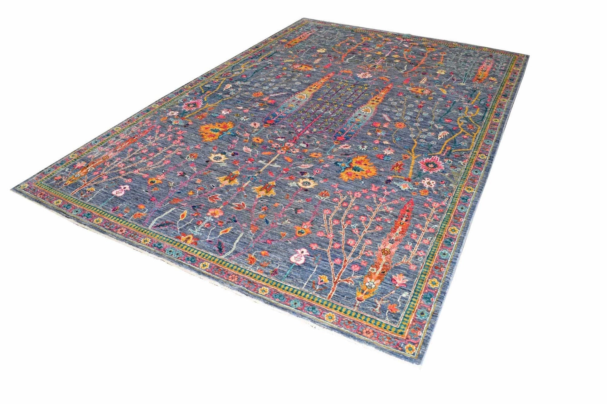 A rectangular Afghan Chobi rug featuring a blue field with intricate floral and tree motifs.