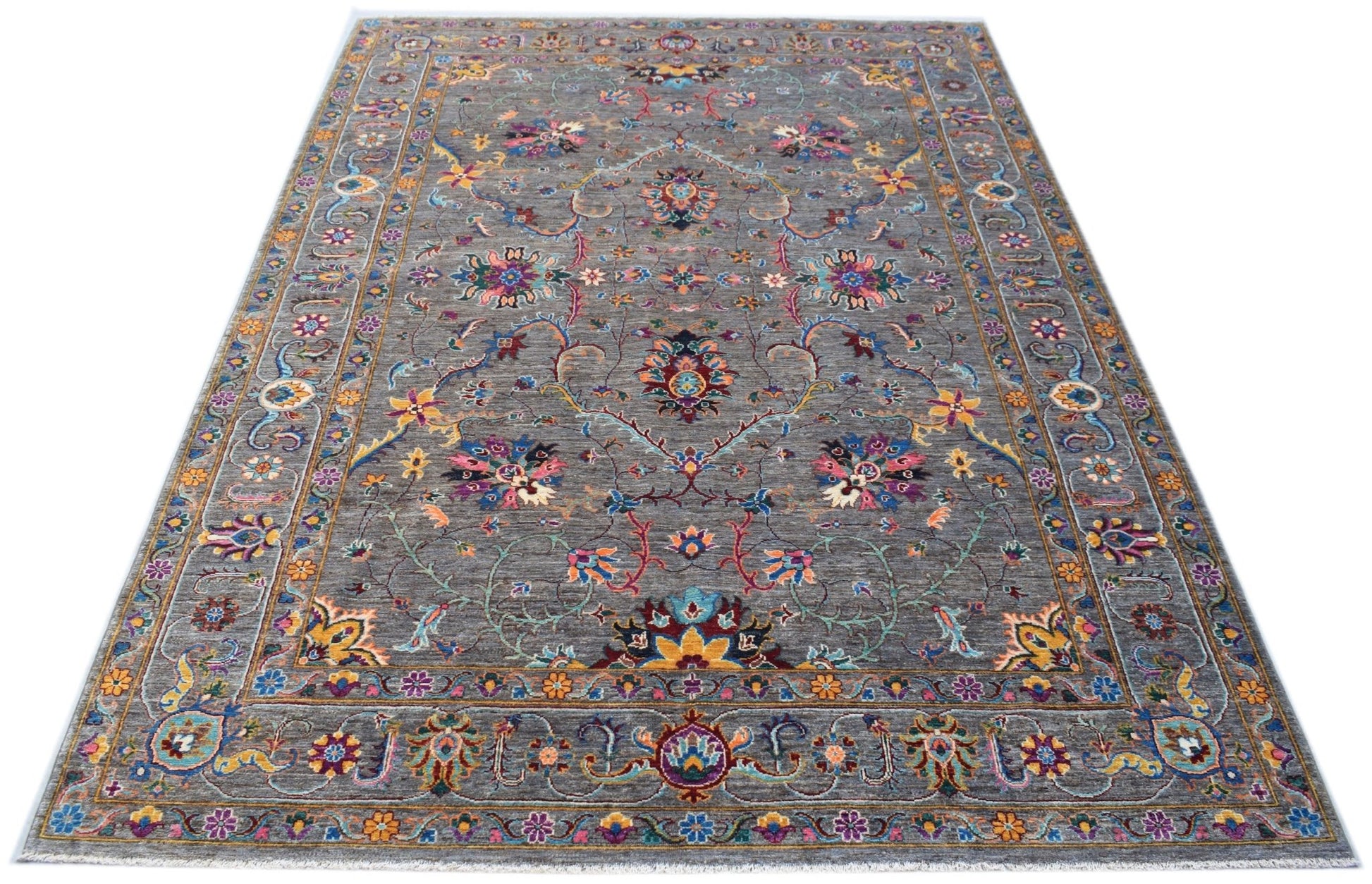 A handmade Afghan Chobi rug featuring a grey field with intricate floral patterns and a border.