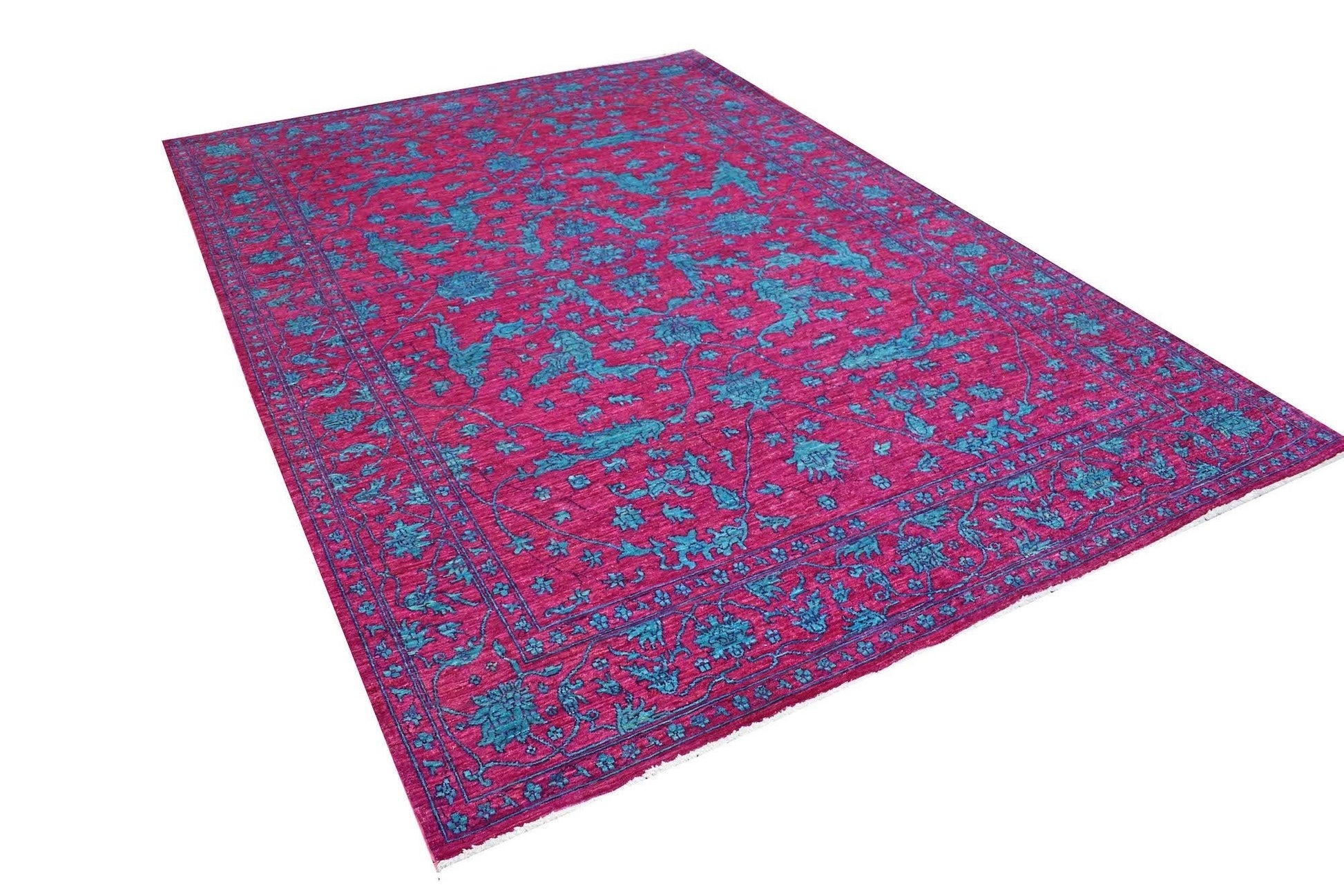 A rectangular Afghan Chobi rug featuring a vibrant magenta field with intricate teal floral motifs.