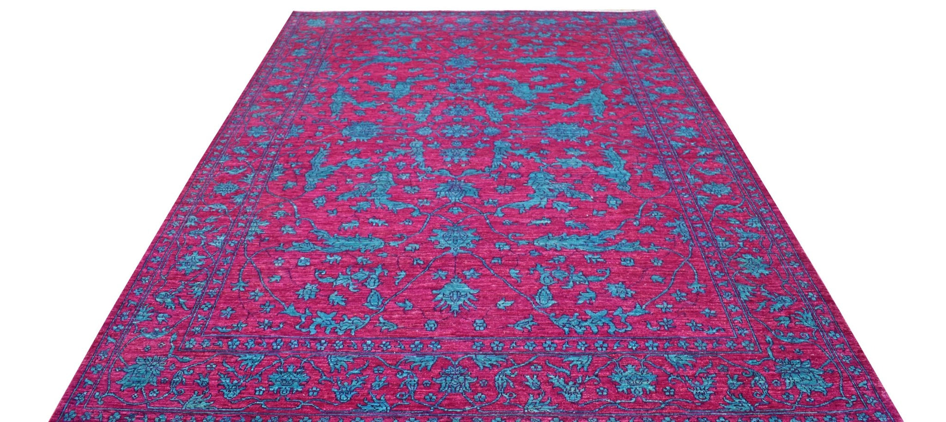 A rectangular Afghan Chobi rug featuring a vibrant magenta background with intricate teal patterns.