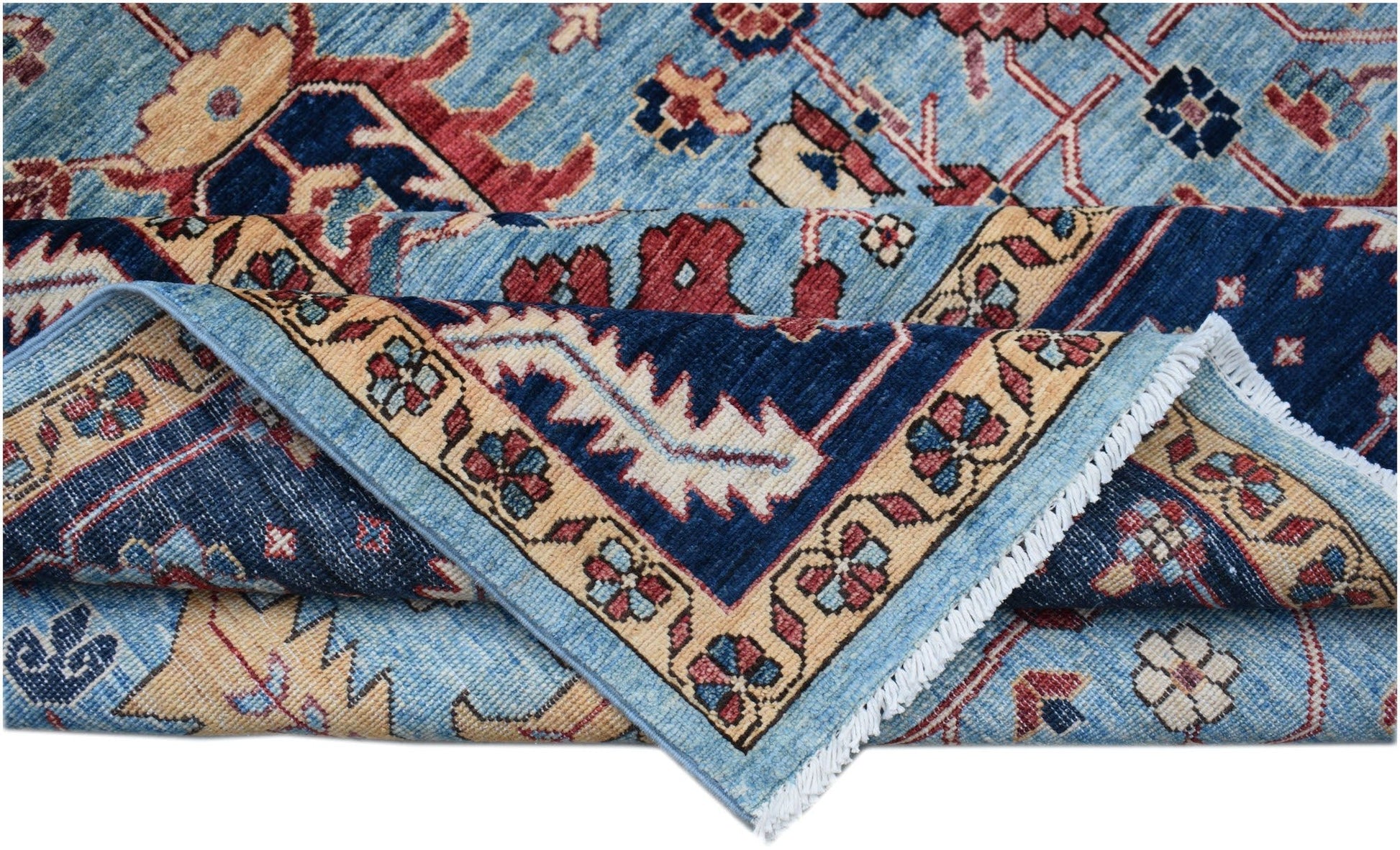 A handmade Afghan Chobi rug featuring a traditional floral pattern in blue, red, and beige tones.