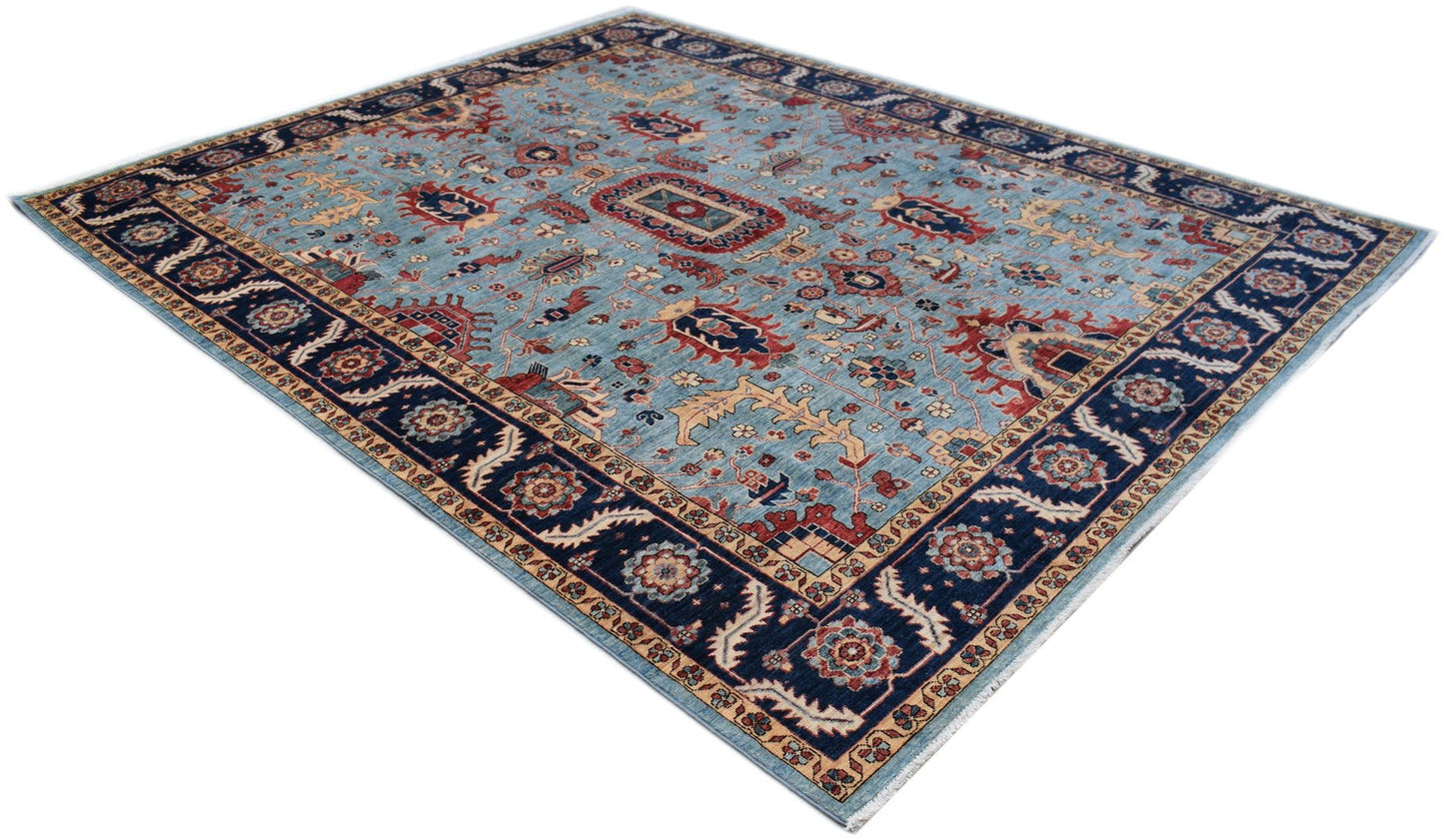 A handmade Afghan Chobi rug featuring a traditional floral pattern in blue, red, and beige tones.