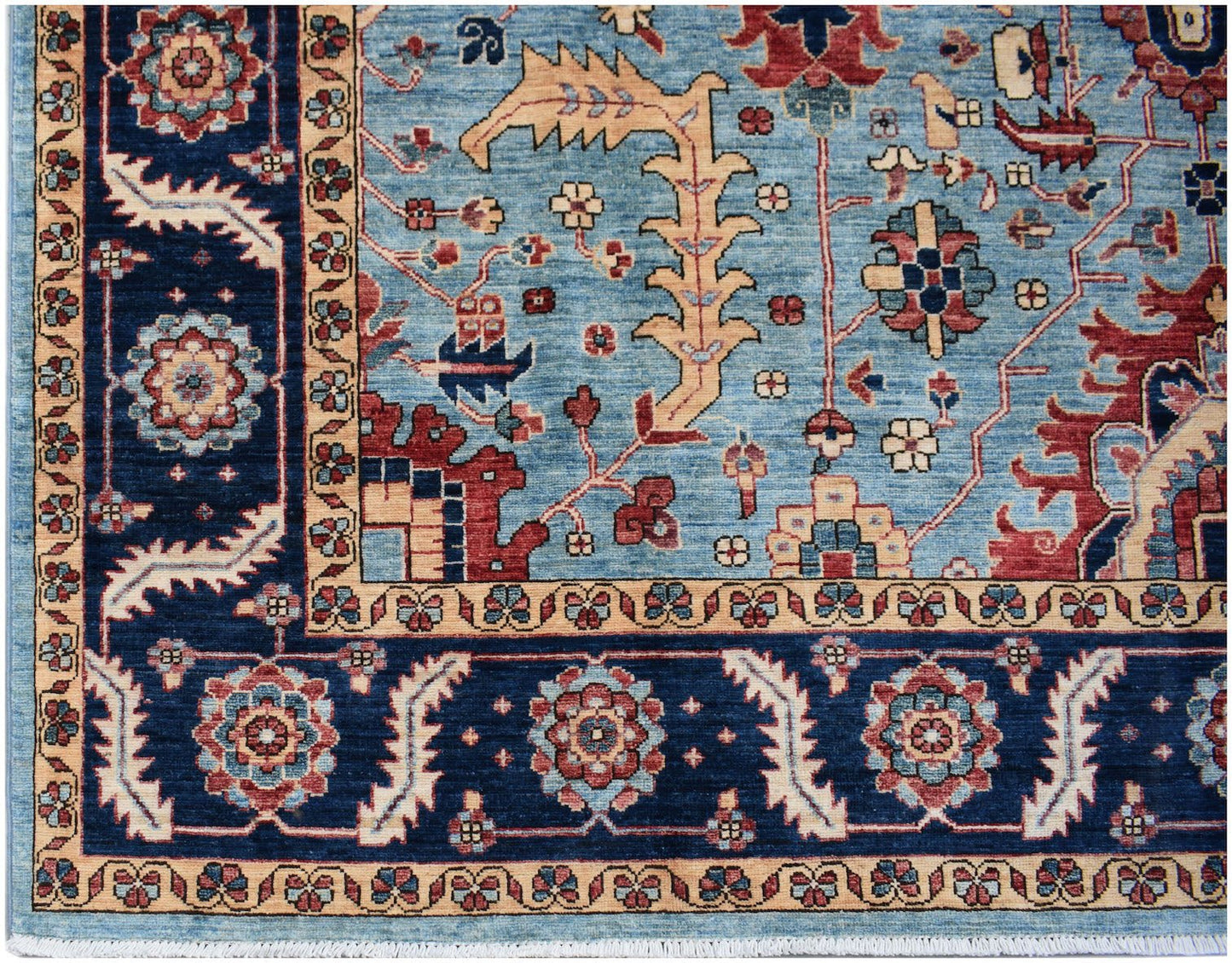 Handmade Afghan Chobi rug featuring a traditional floral pattern in blue, red, and beige tones.