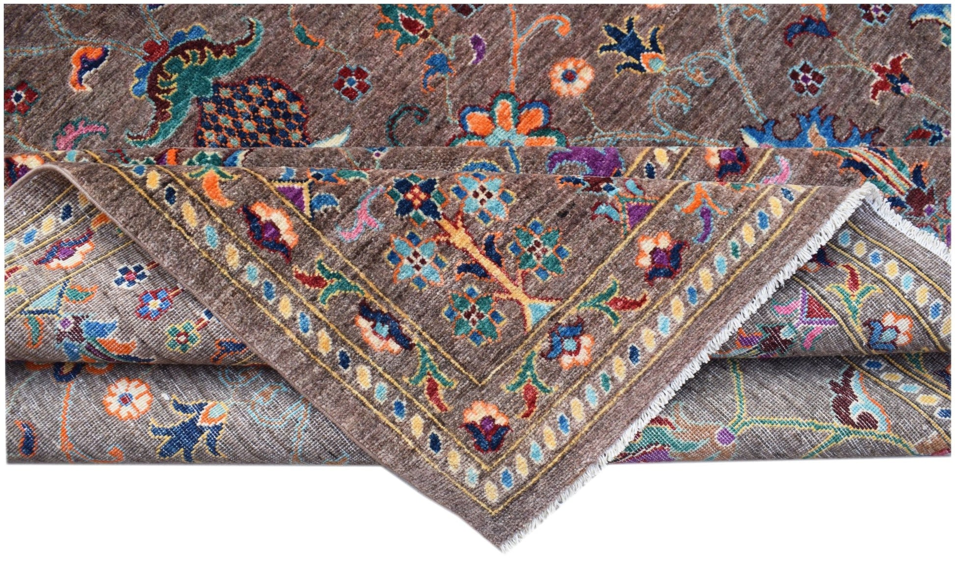 A handwoven Afghan Chobi rug featuring a brown field with colorful floral and vine patterns.