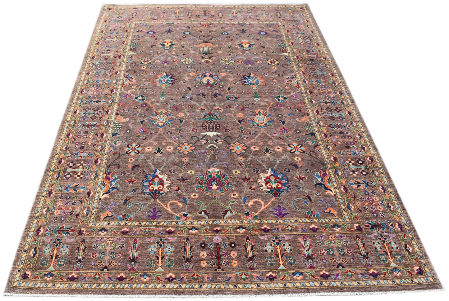 A rectangular Afghan Chobi rug featuring a traditional floral pattern in vibrant colors on a brown background.