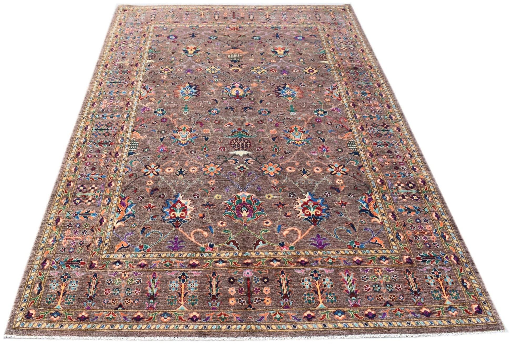 A rectangular Afghan Chobi rug featuring a traditional floral pattern in vibrant colors on a brown background.