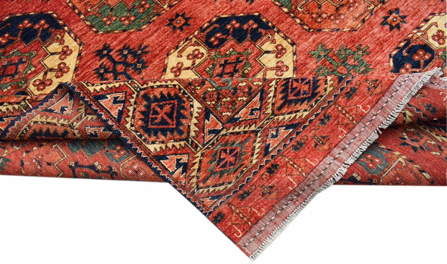 An Afghan Chobi rug featuring traditional geometric patterns in red, blue, and cream tones.