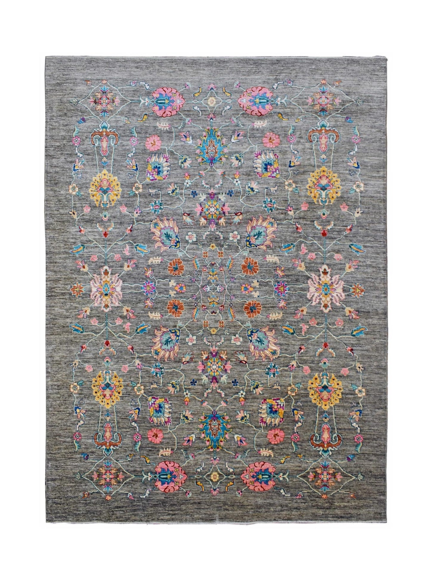 Handwoven Afghan Chobi rug featuring a floral pattern in vibrant colors on a grey wool background.