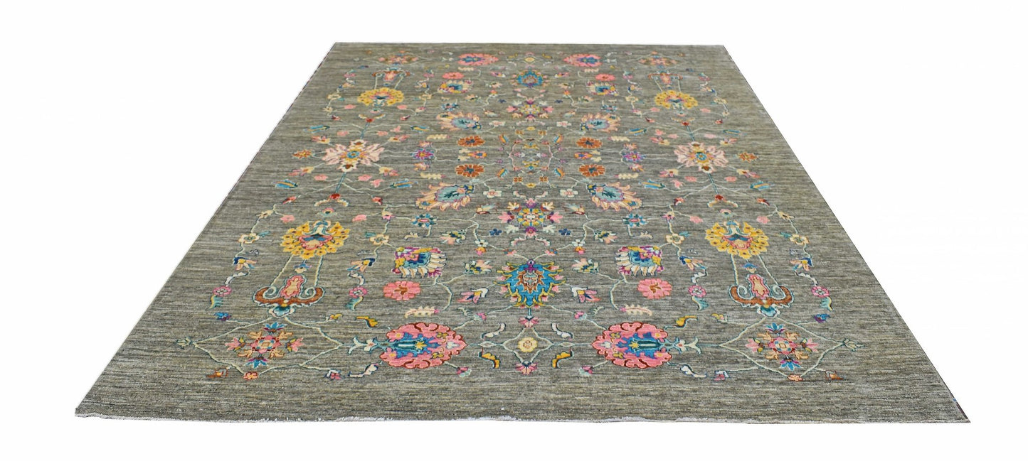 Handwoven Afghan Chobi rug featuring a floral pattern in vibrant colors on a grey wool background.