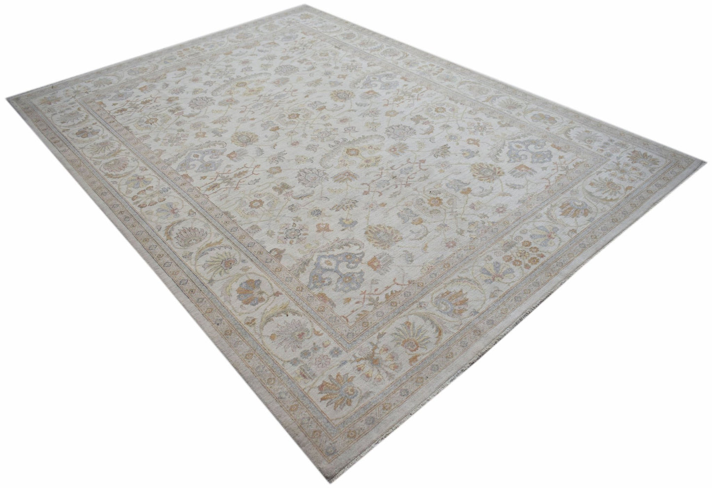 An Afghan Chobi rug featuring a traditional floral pattern in soft, neutral earth tones.