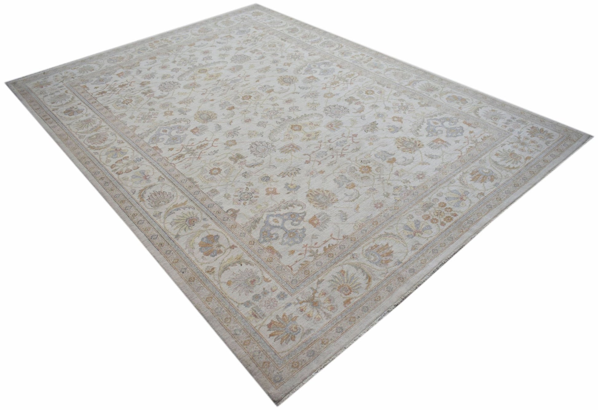 An Afghan Chobi rug featuring a traditional floral pattern in soft, neutral earth tones.