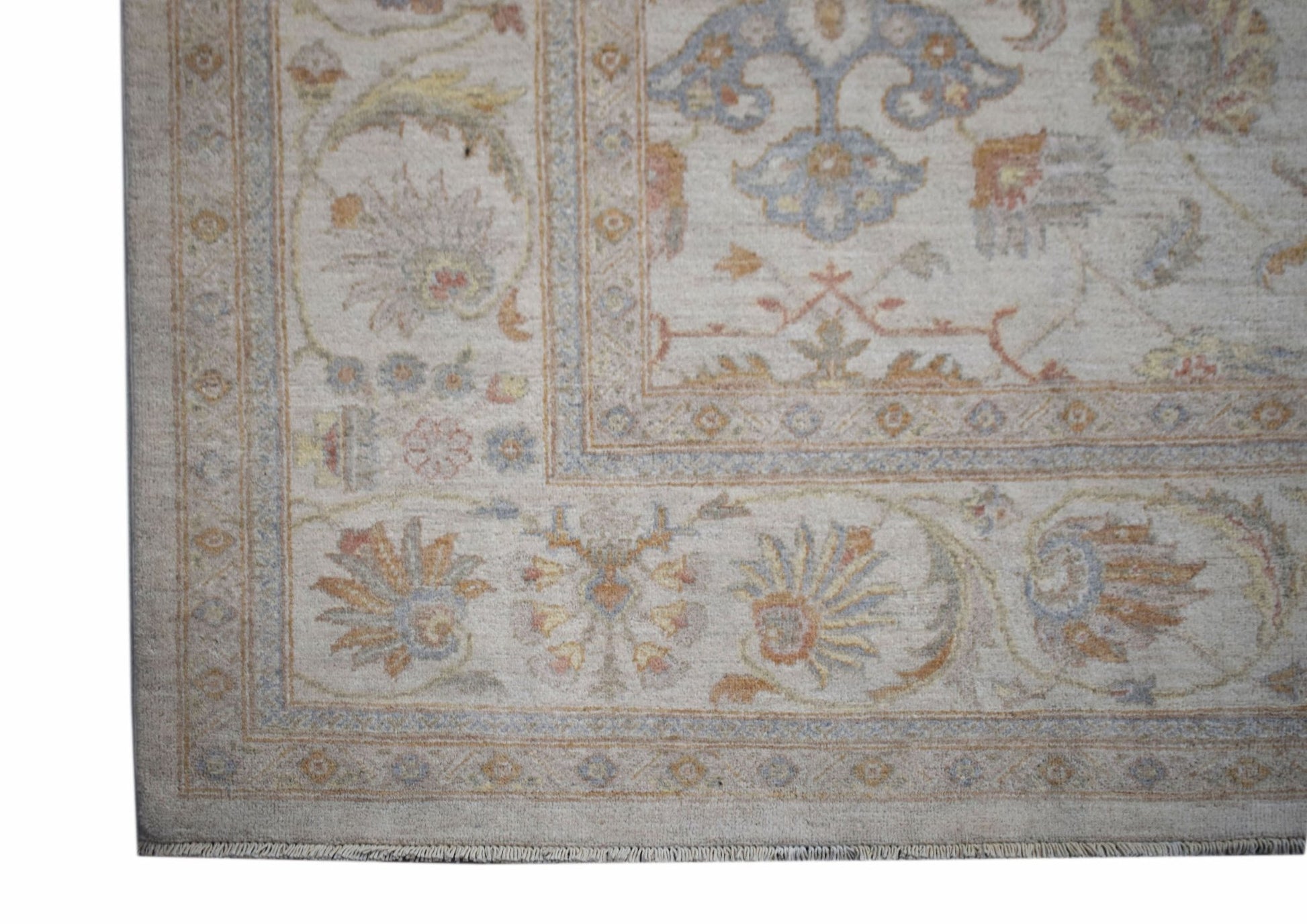 A handmade Afghan Chobi rug featuring a traditional floral pattern in soft, earthy tones.